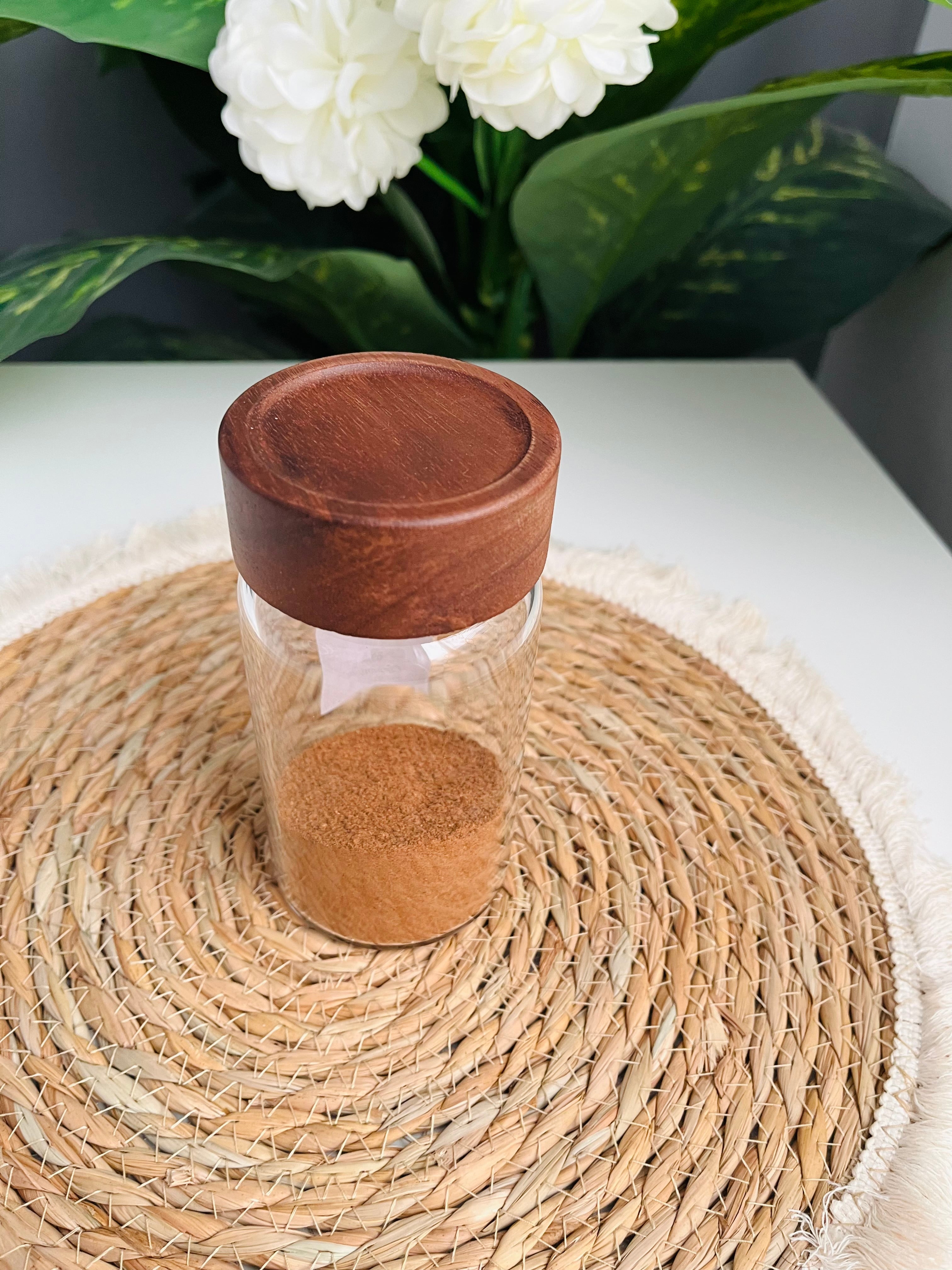 Single 300ml clear glass storage jar with a dark brown wooden lid standing on a white background
