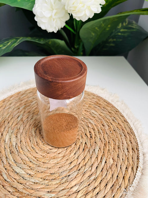 Single 300ml clear glass storage jar with a dark brown wooden lid standing on a white background