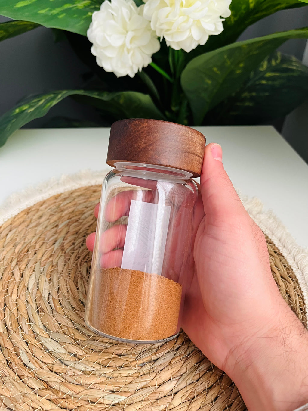 Single 300ml clear glass storage jar with a dark brown wooden lid standing on a white background