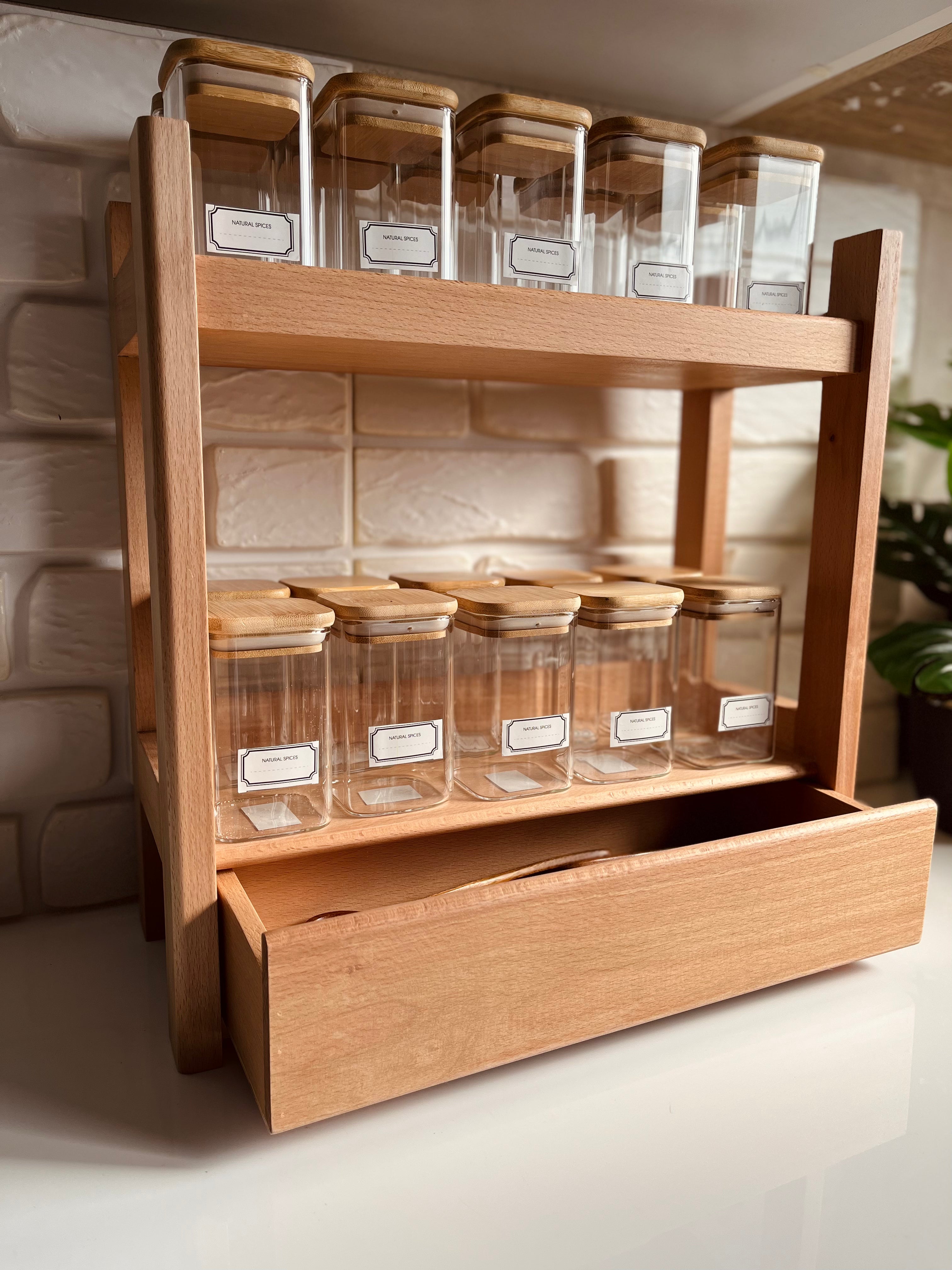 large wooden spice organizer stand with bottom drawer holding 20 clear 250ml glass jars