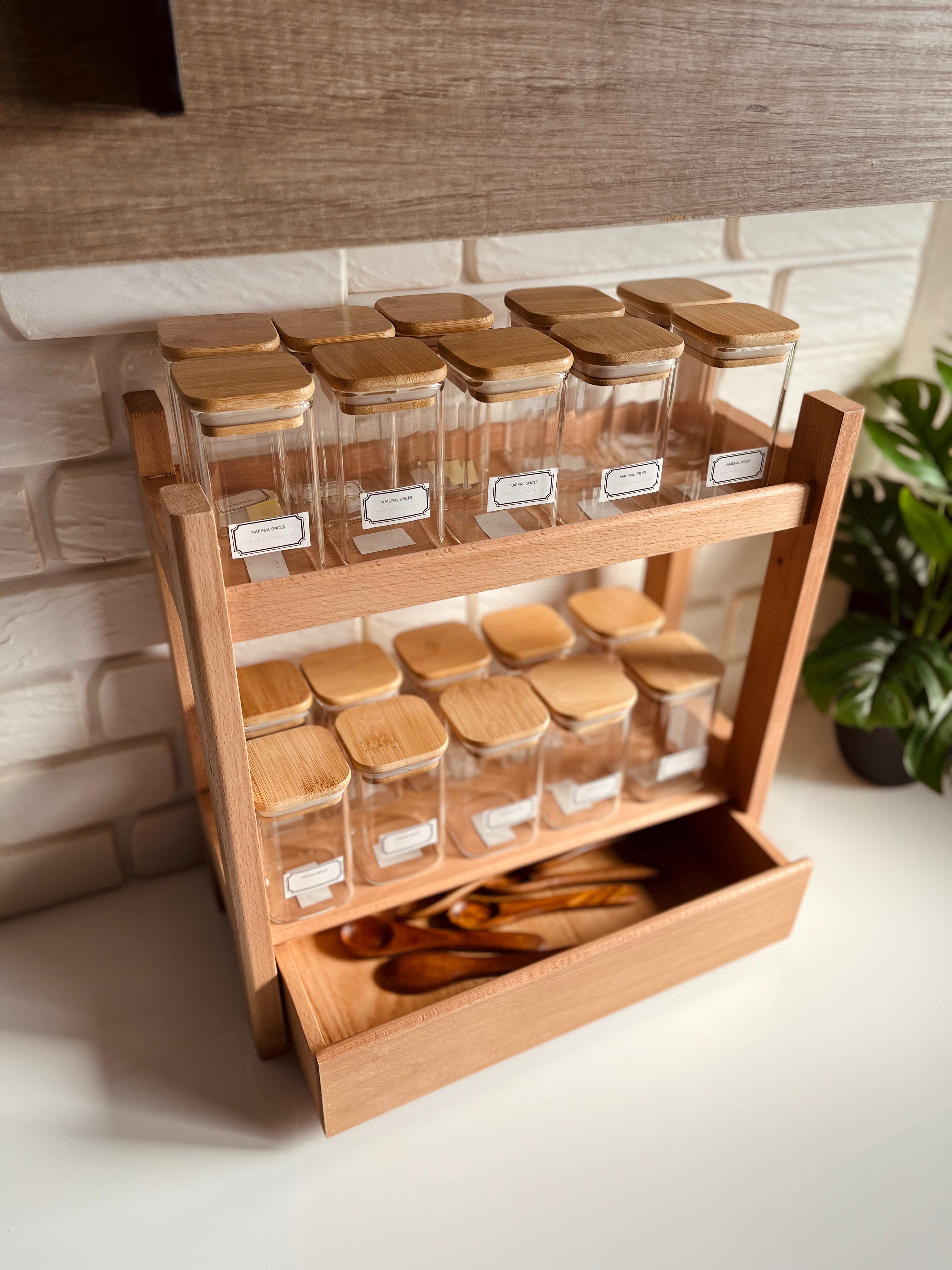 large wooden spice organizer stand with bottom drawer holding 20 clear 250ml glass jars