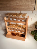 large wooden spice organizer stand with bottom drawer holding 20 clear 250ml glass jars